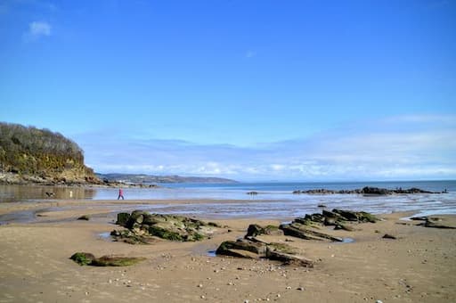 "Enjoy the pristine beauty of Saundersfoot Beach, easily accessible via Tenby taxis for a memorable coastal experience."