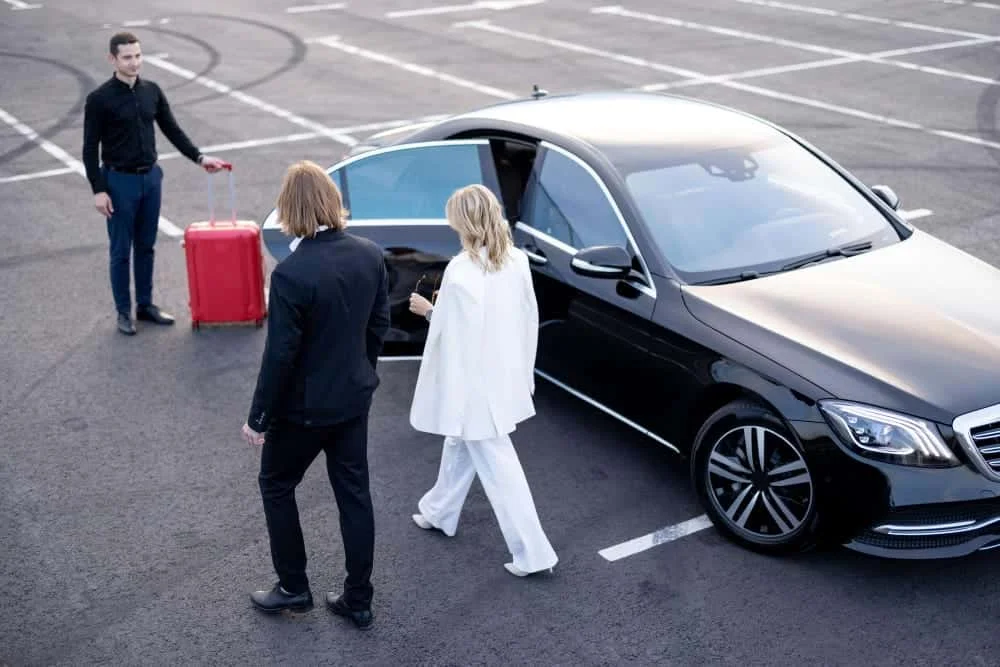 "A delighted couple experiencing hassle-free airport transfer Tenby and Saundersfoot taxi service with Z Car Taxi driver."