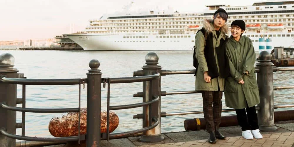"Happy couple at Tenby ferry terminal, preparing for their journey with convenient access to Tenby taxis and Saundersfoot taxis."